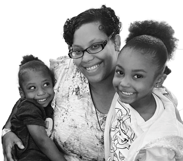 mom and two kids smiling feature