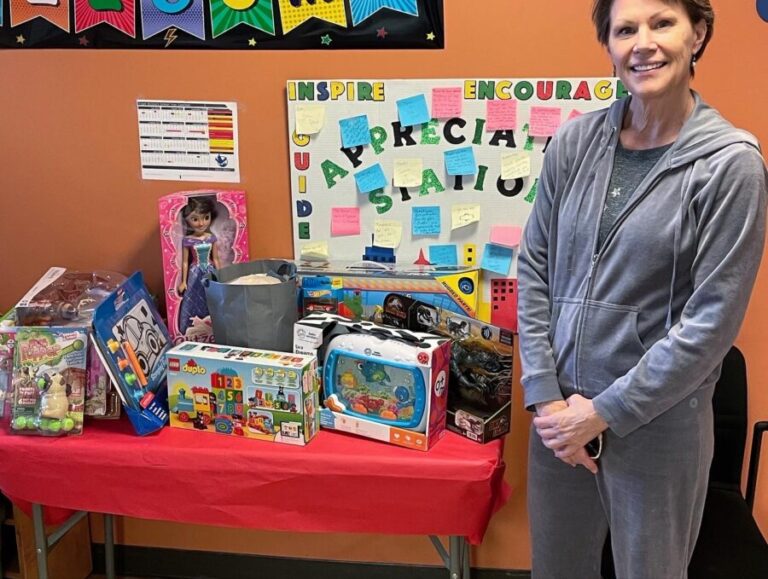 Volunteer in front of toys