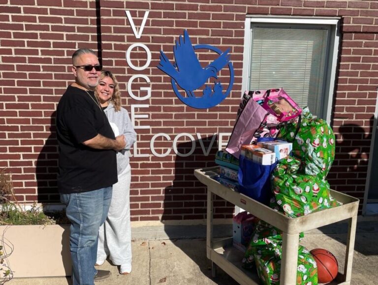 Volunteers with toys in front of Vogel Alcove
